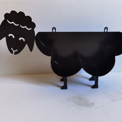 Toilet roll holder with animal motif